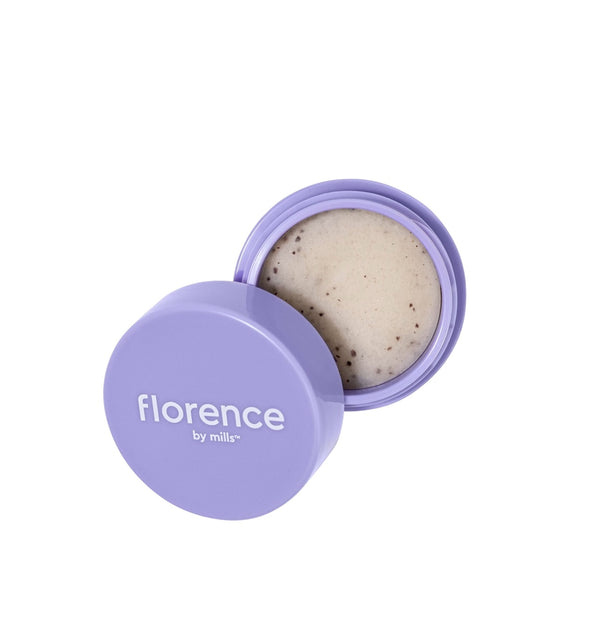 Cosmetic container with cream inside, branded 'florence by Mills', on a white background